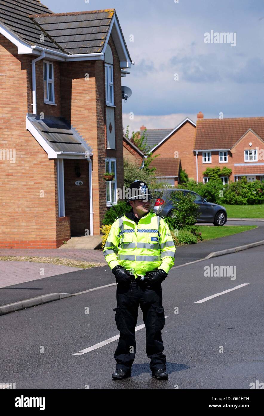 Police close a road in Saxilby, Lincolnshire leading to a house which was raided in connection with the attack in Woolwich, London. Stock Photo