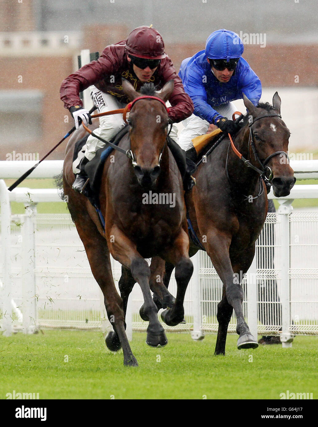 Kiyoshi, ridden by Adam Kirby (left) go on to win the British Stallion Studs Supporting British Racing E.B.F Fillies Stakes during the May Festival at Goodwood Racecourse, West Sussex. PRESS ASSOCIATION Photo. Picture date: Thursday May 23, 2013. Photo credit should read: Sean Dempsey/PA Wire. Stock Photo