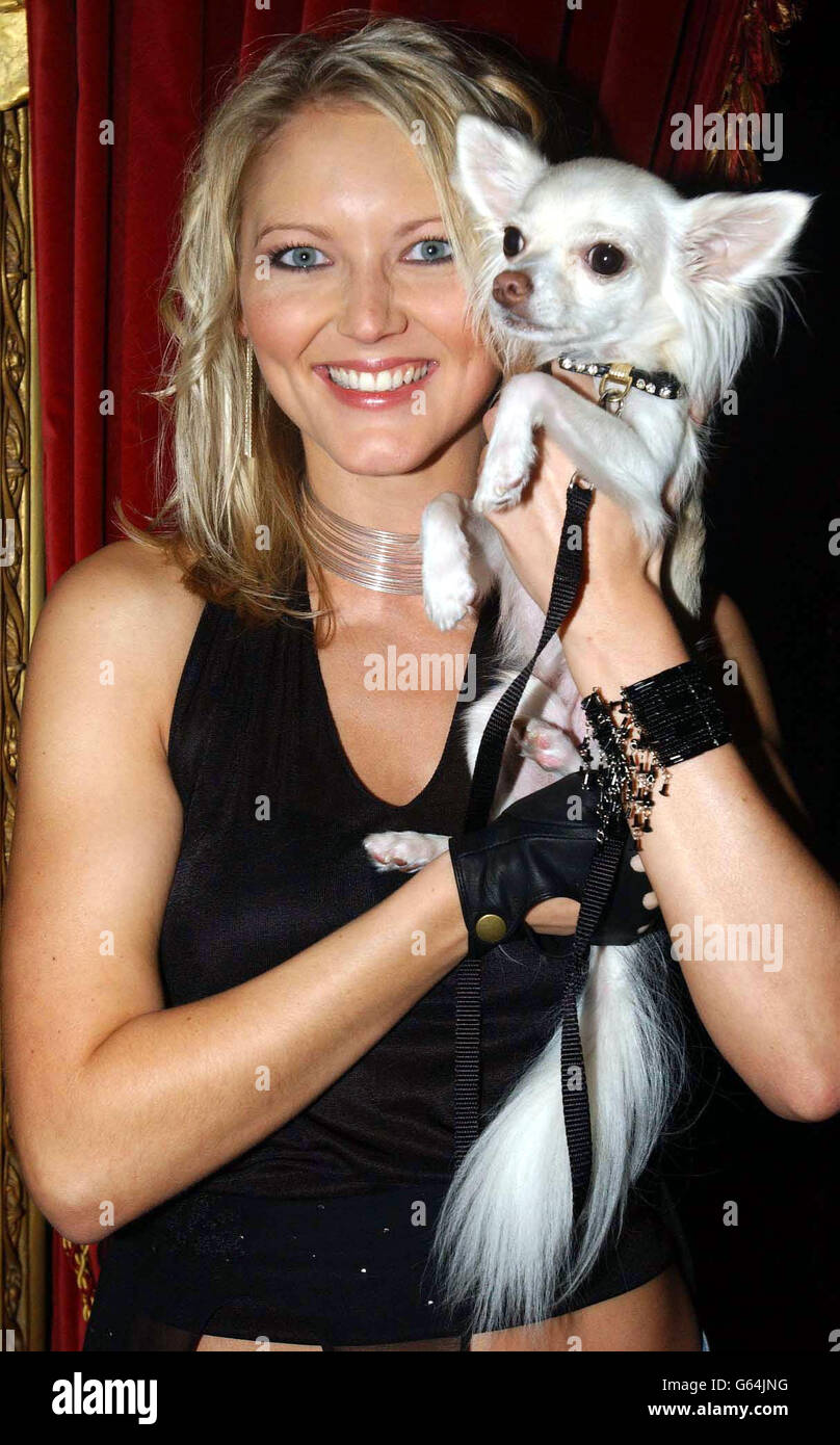 Nightclub owner Peter Stringfellow's girlfriend Lucy Carr with her pet dog George during the launch of her new debut single 'Missing You' on Peter's new record label Lickin Records at Stringfellows in central London. Stock Photo