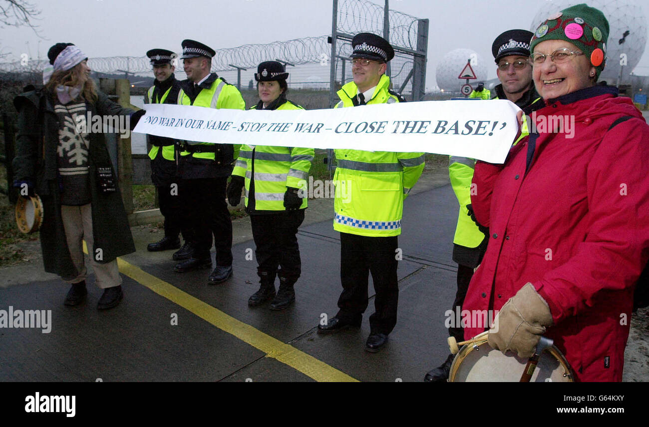 Anti-war protesters demonstrate against war with Iraq outside the gates of RAF Menwith Hill, North Yorkshire. Protesters from the Campaign Against Nuclear Disarmament joined forces with protesters from numerous other human rights organisations. * with a heavy police presence to show their discontent at war with Iraq and to call for world peace, outside the largest electronic monitoring station in the world. Stock Photo
