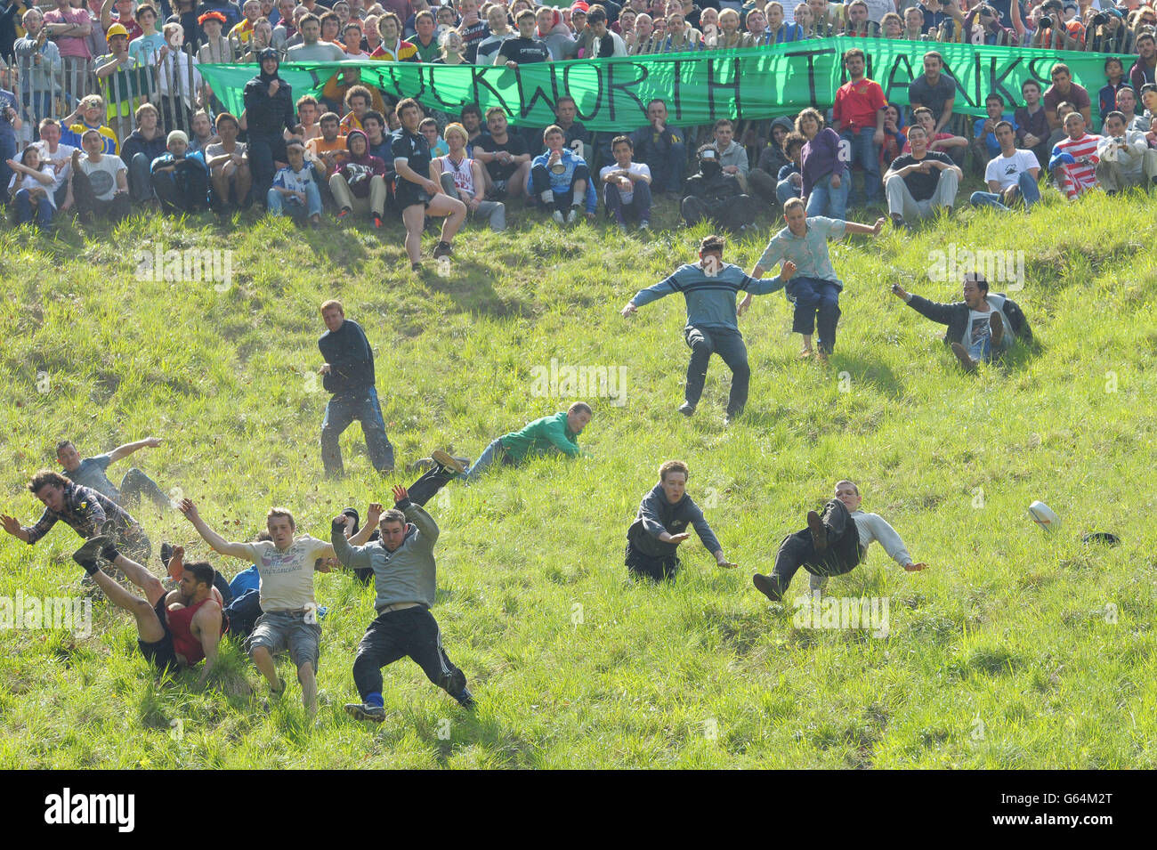 Competitors take part in the annual Cheese Rolling event at Coppers Hill near Brockworth, Gloucestershire. Stock Photo