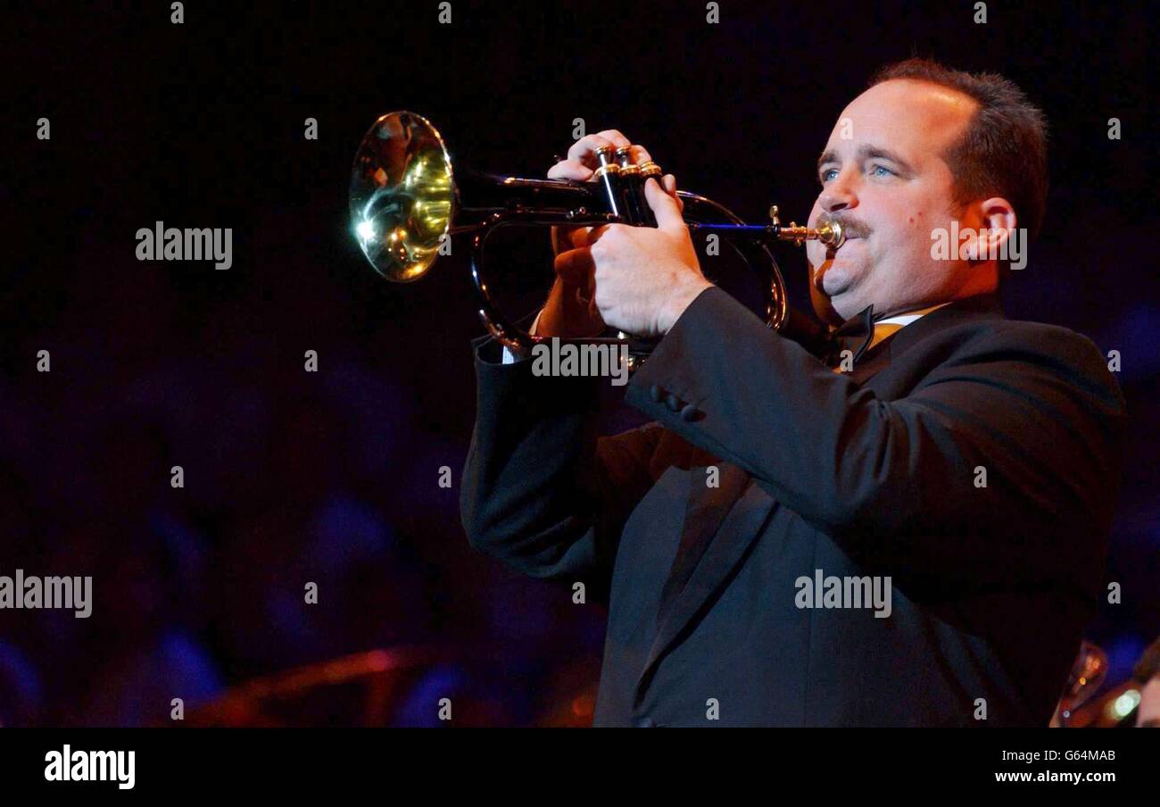 Trumper player Mark Walters, from Sheffield, whose music appeared in the film Brassed Off, performing on stage during the TV Times Christmas Carols concert - in aid of Leukaemia Research - at the Royal Albert Hall in London. Stock Photo