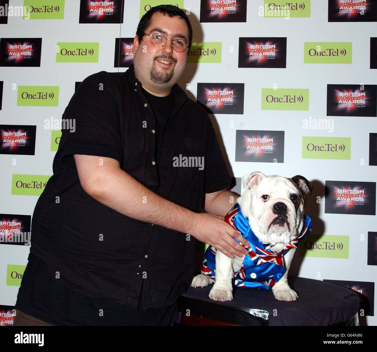 Comedian Ewen Macintosh with pedigree British bulldog Albert, at the launch party for The British Comedy Awards, at Sway in Covent Garden. Stock Photo