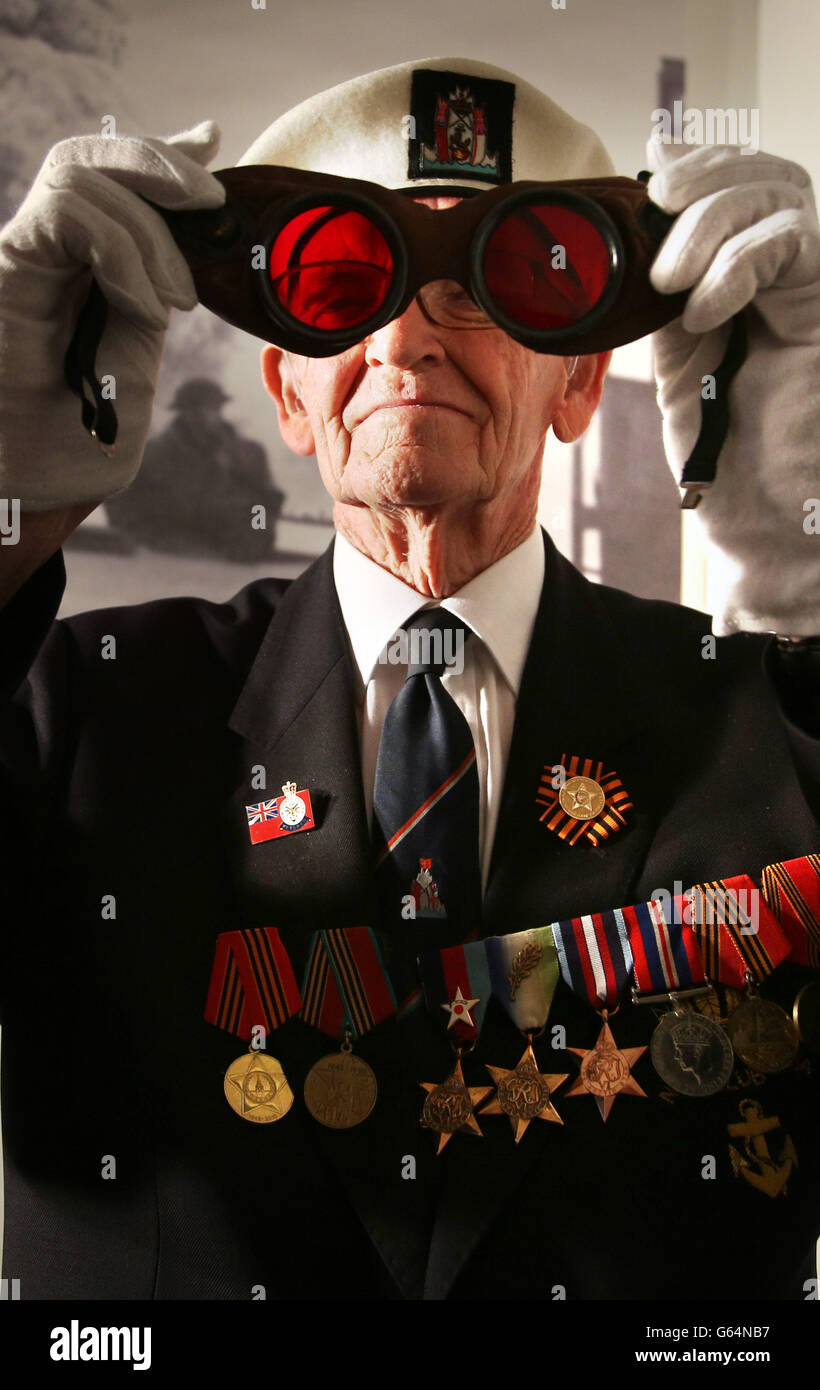 David Craig, a former merchant navy seaman, looks at a pair of Arctic goggles as part of the Arctic Convoys exhibition which opens on May 29 at the National War Museum at Edinburgh Castle. The convoys sailed from Britain from in 1941 to 1945 delivering supplies to the Soviet Union. Stock Photo