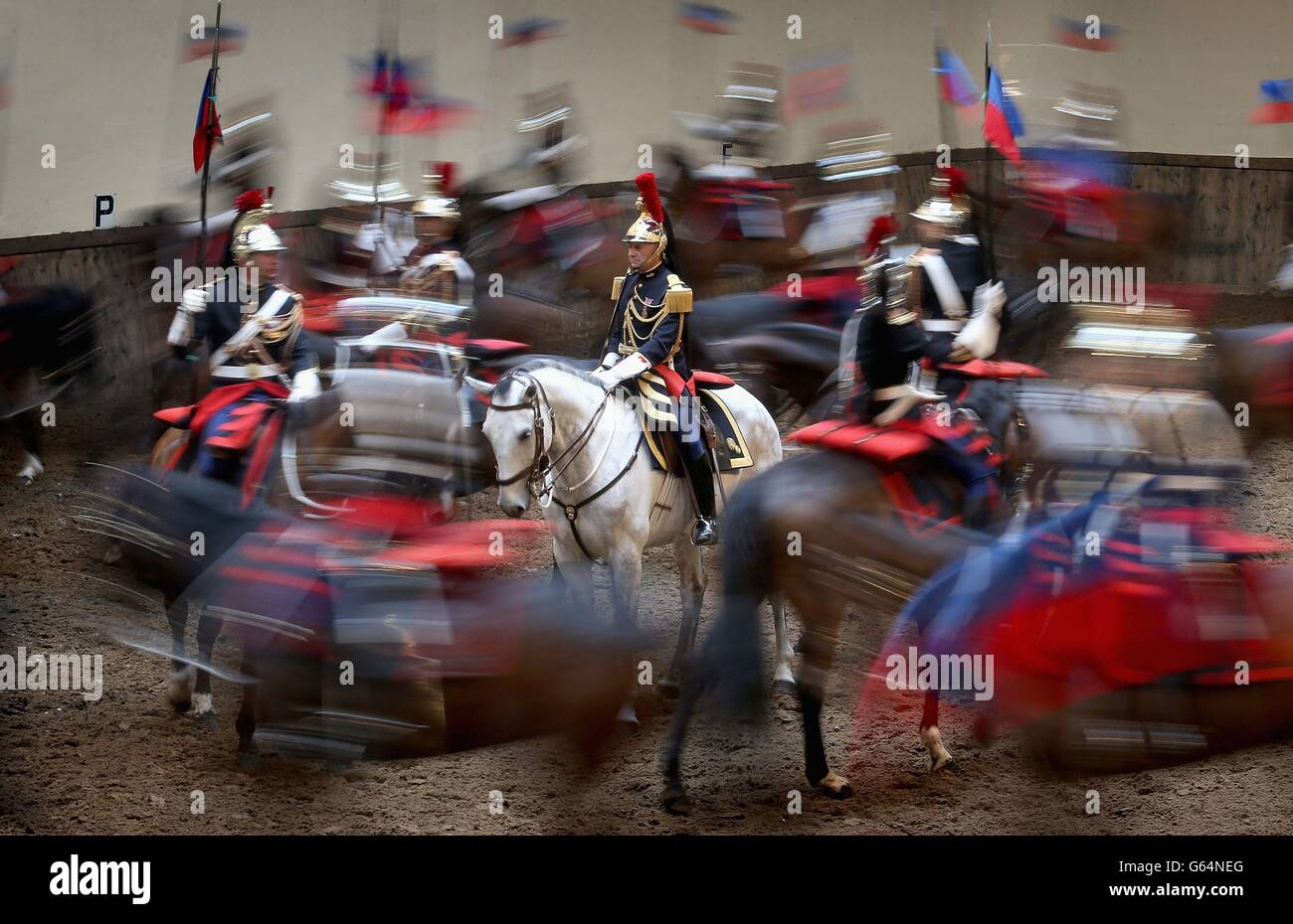 Members of the French Republic Guard perform for the Duchess of Cornwall during her visit to their headquarters in Paris, France. Stock Photo