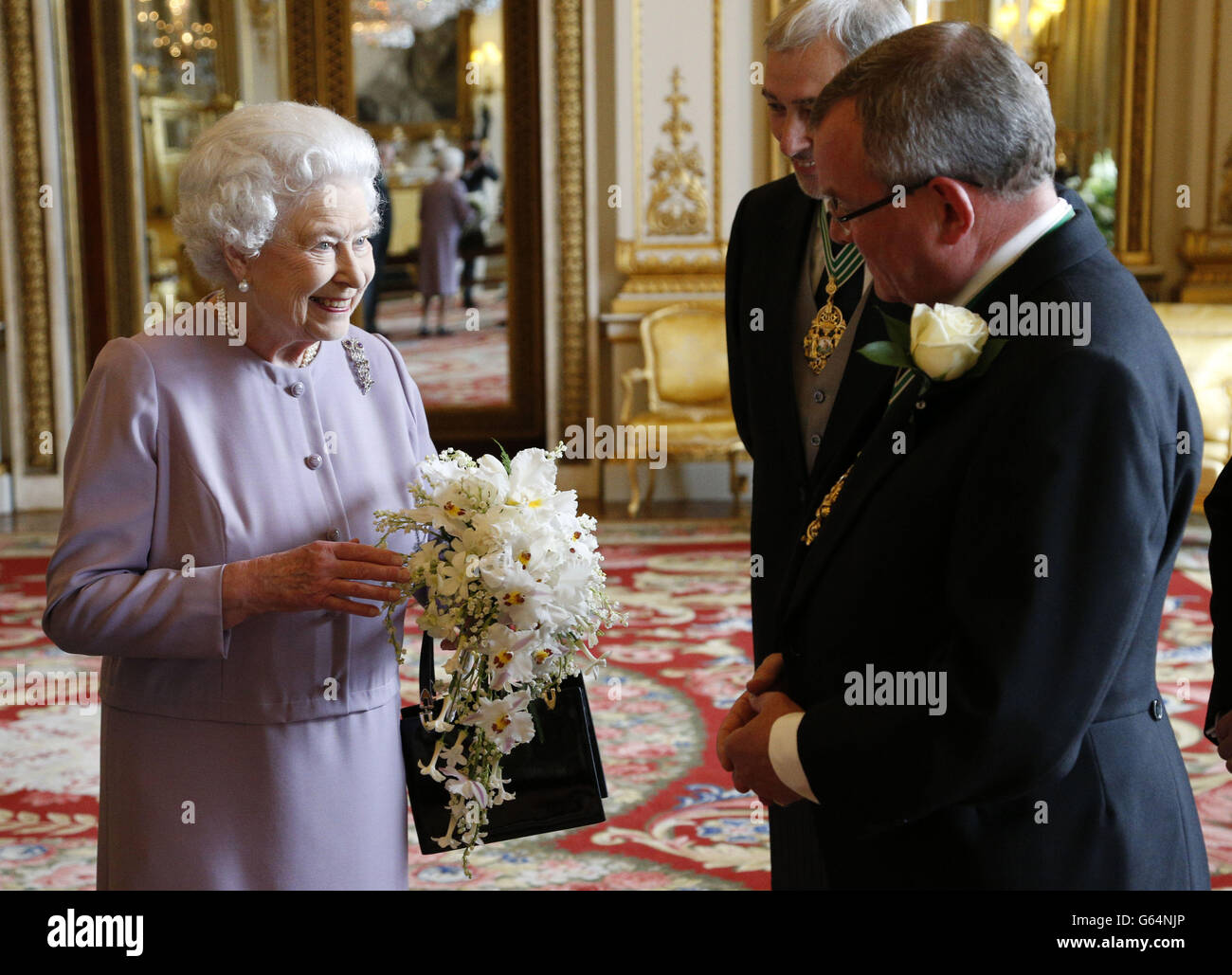 A replica of the Coronation Bouquet is presented to Queen ...