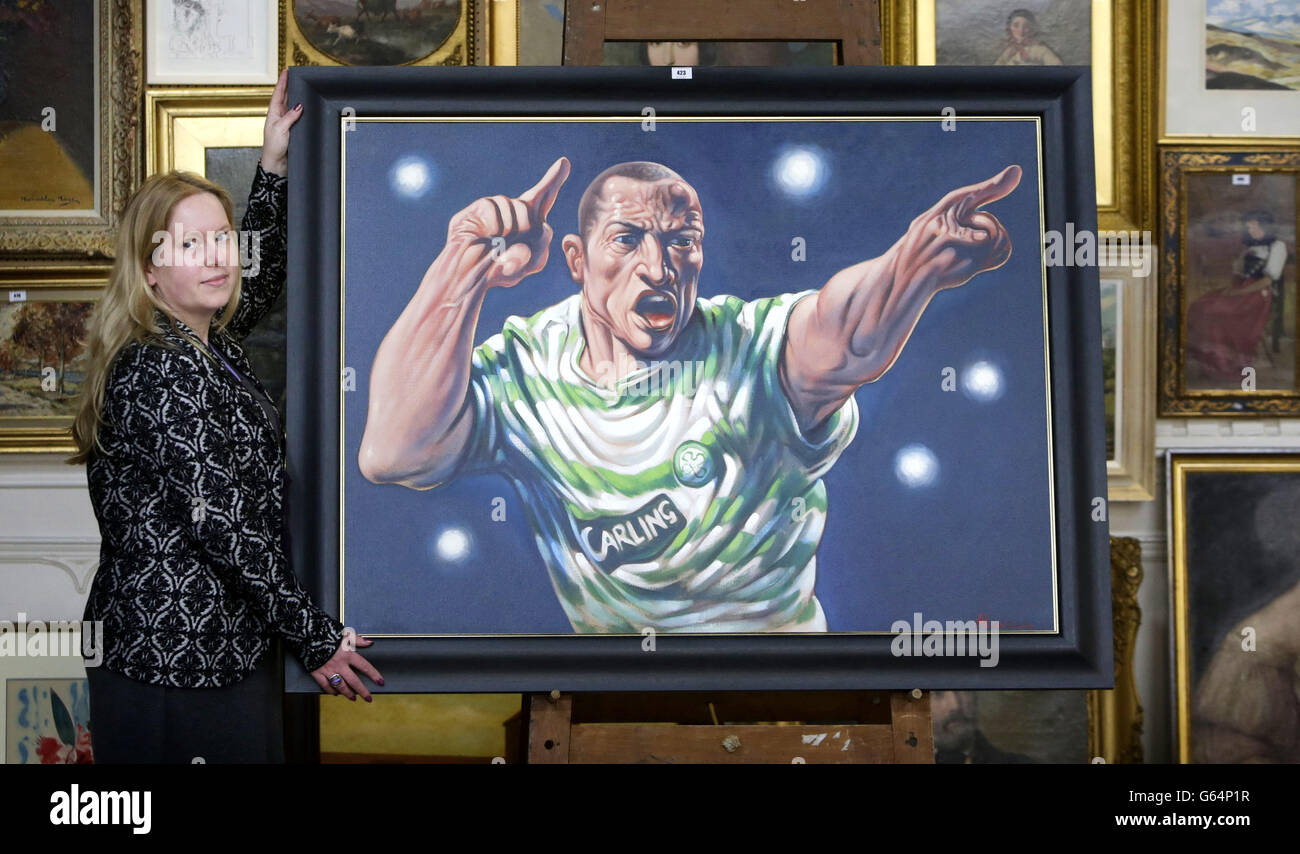 Auctioneer Claire Godwyn with a painting of Henrik Larson in Celtic colours by artist Peter Howson estimated at £15,000 to 25,000, that will be auctioned at the Great Western Auctions Summer Fine Arts and Antiques sale in Glasgow Scotland. Stock Photo