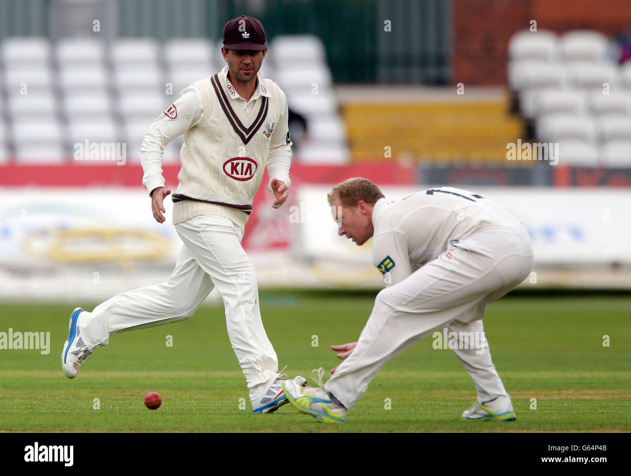 Surrey's Ricky Ponting fields with captain Gareth Batty during the LV= County Championship, Division One match at the County Ground, Derby. Stock Photo