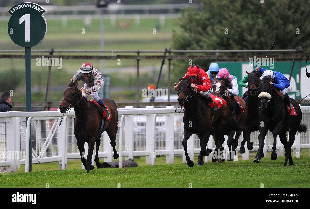 Gloomy Sunday (far left), ridden by Olivier Peslier goes onto win The Seymour Pierce Henry II Stakes during the Cantor Fitzgerald Brigadier Gerard Evening at Sandown Park Racecourse, Surrey. Stock Photo
