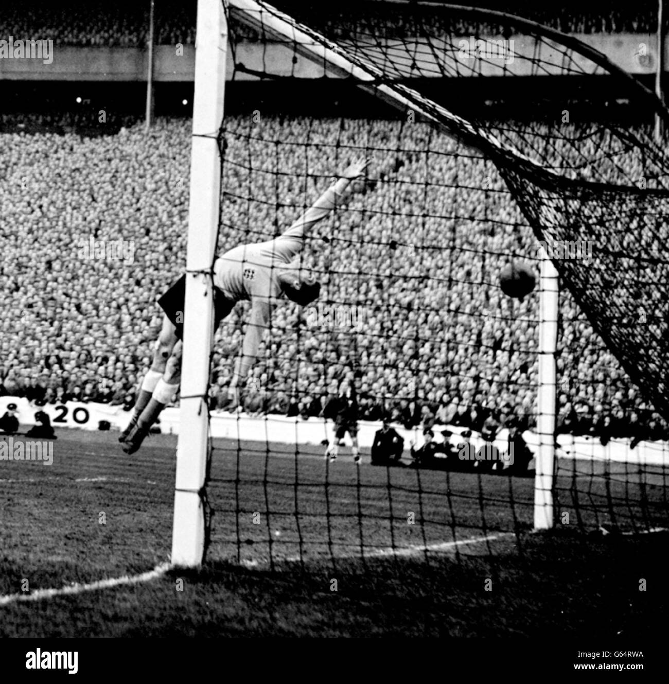 England goalkeeper Matthews arches in a backward bend but he cannot save this shot from outside right Leggat, which gave Scotland the lead in the international soccer match at Hampden Park, Glasgow. Stock Photo