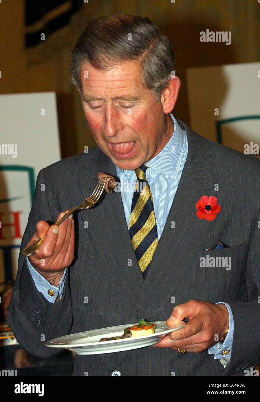The Prince of Wales samples some beef at a British beef promotion reception at the Hotel Parco dei Principi, in Rome. It was the second day of Prince Charles official cultural tour in Italy, which also takes in Naples. Stock Photo
