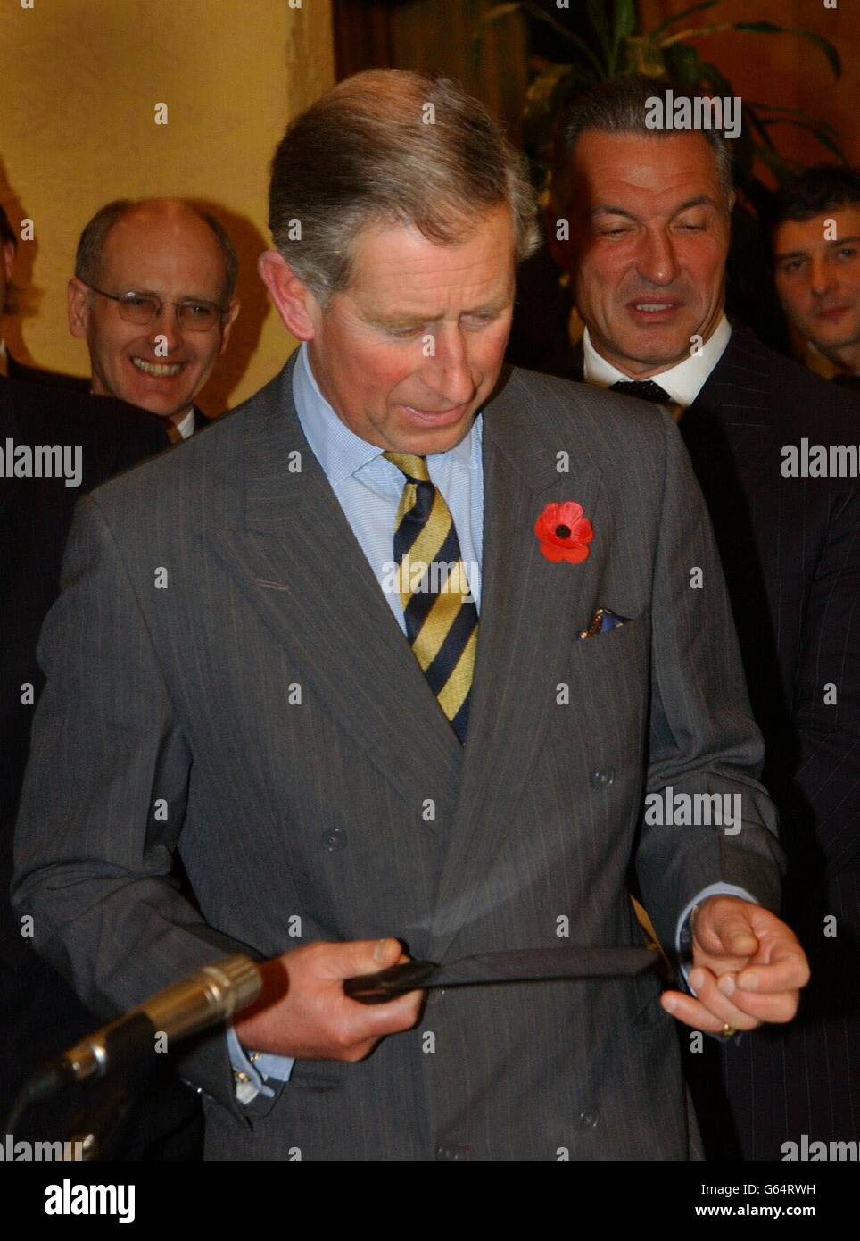 The Prince of Wales checks the sharpness of a carving knife before sampling beef at a British beef promotion reception at the Hotel Parco dei Principi, in Rome. It was the second day of his official cultural tour in Italy, which also takes in Naples Stock Photo