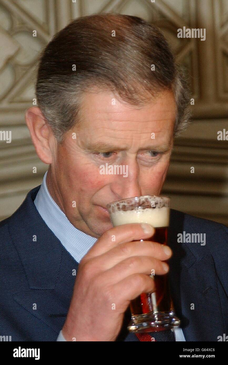 The Prince of Wales samples a glass of Abbott's Ale beer, at St James's Palace. The Prince was receiving an award from the all-party Parliamentary Beer Group. * He was named 'Beer Drinker of the Year 2002', in recognition of his heading of the 'Pub is the Hub' campaign which aims to make the village pub remain a cornerstone of the local community. Stock Photo
