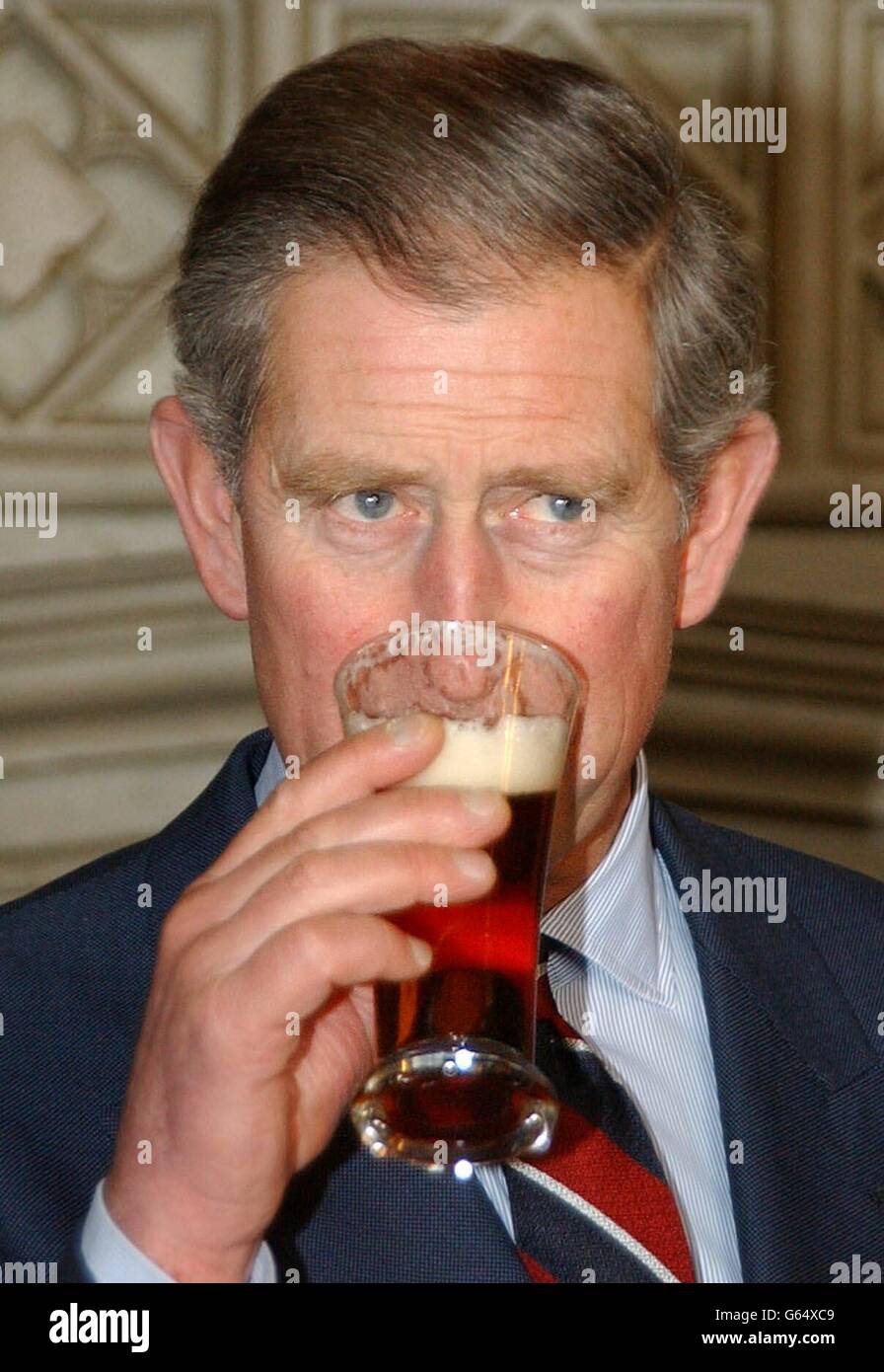 The Prince of Wales samples a glass of Abbott's Ale beer, at St James's Palace, London. The Prince was receiving an award from the all-party Parliamentary Beer Group. * He was named 'Beer Drinker of the Year 2002', in recognition of his heading of the 'Pub is the Hub' campaign which aims to make the village pub remain a cornerstone of the local community. Stock Photo