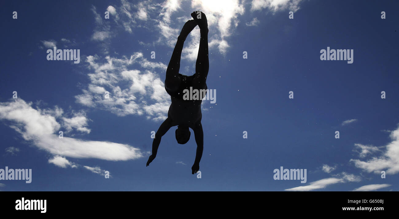 A man dives into Gourock Outdoor Pool in Scotland as the hot weather continues. Stock Photo