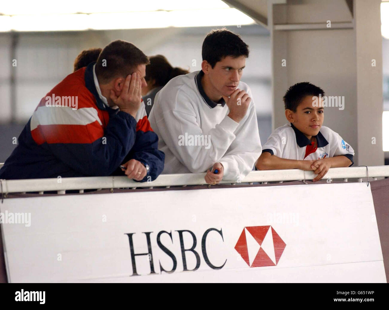 British tennis star Tim Henman watches the play during the National Finals of the HSBC/British Schools Tennis Team Competitions 2002 at the Redbridge Sports Centre in Barkingside, Essex. Stock Photo