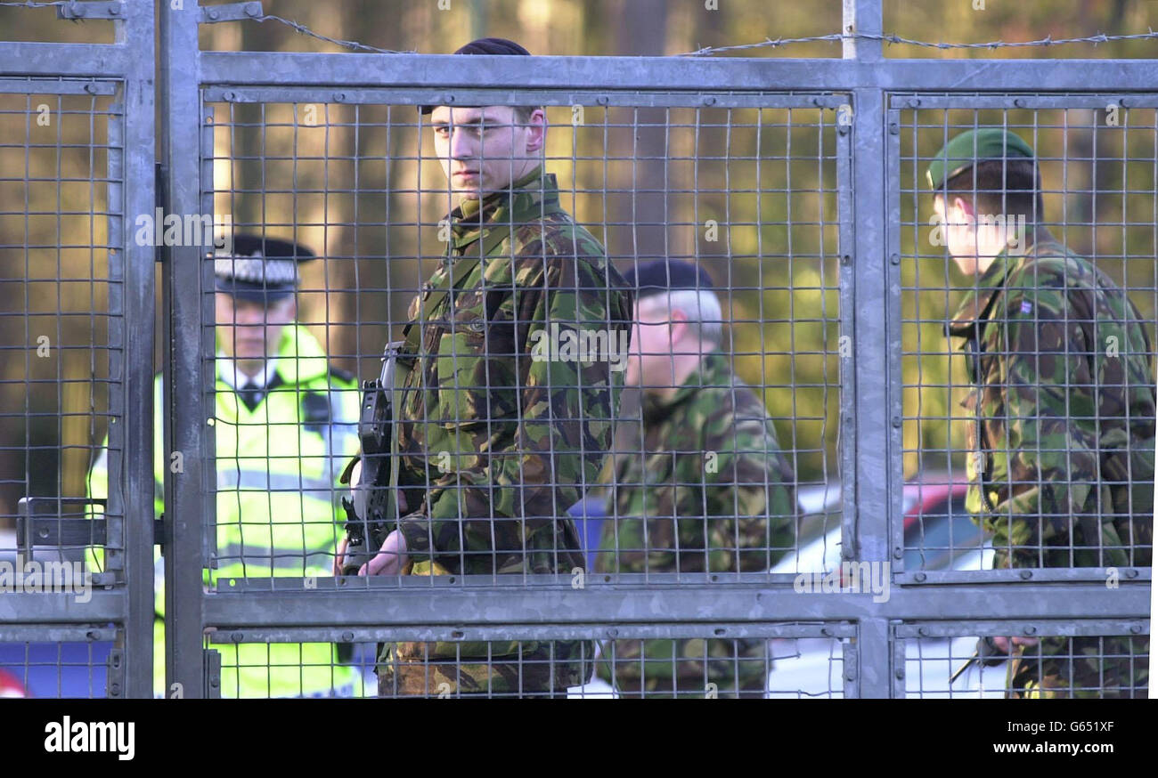 Soldiers guard the gate at Deepcut army barracks in Surrey, which is being investigated by police after four deaths. Stock Photo