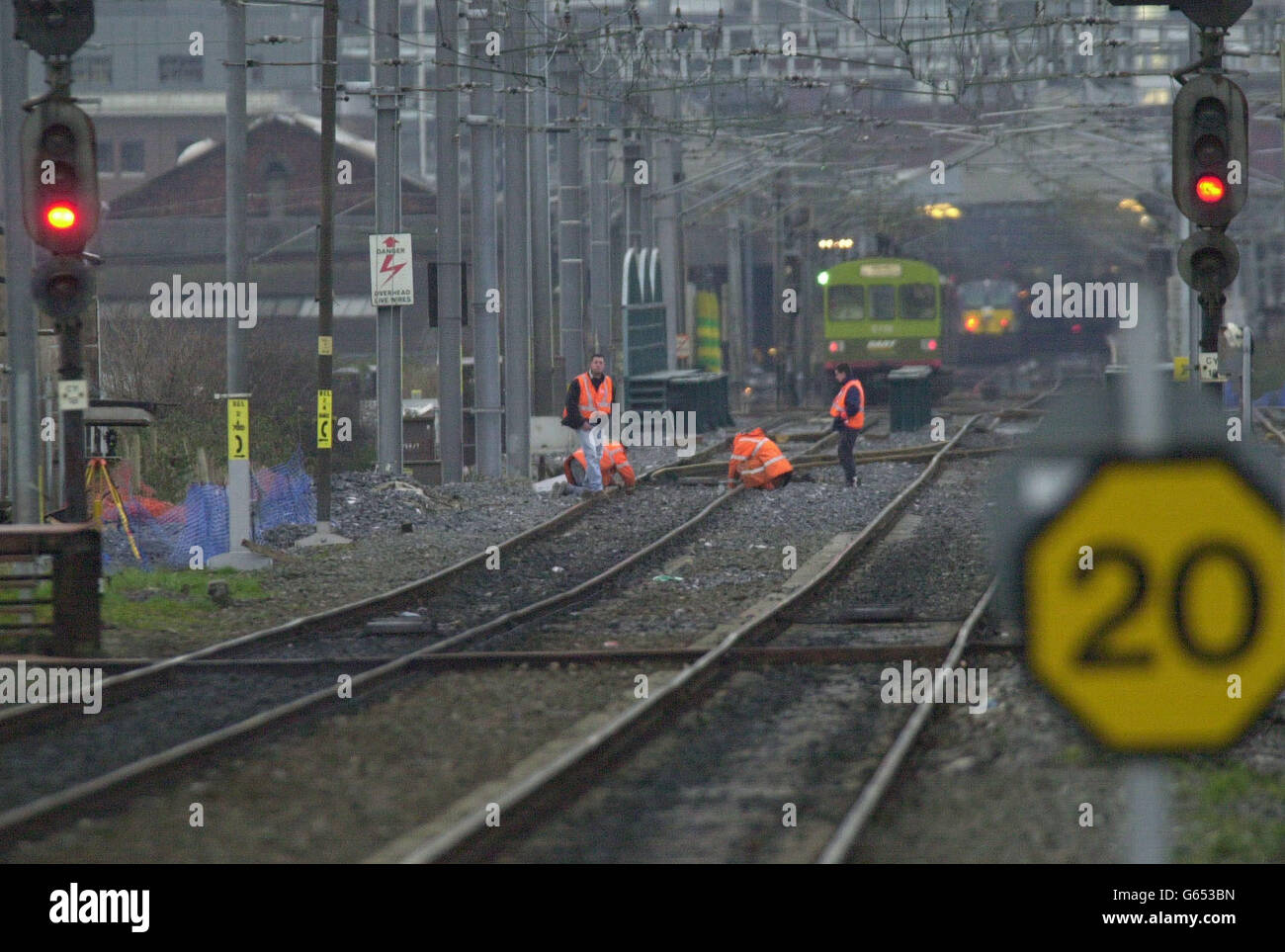 Rail workers working on subsided railtracks that delayed trains, on northern routes into the Irish capital s biggest rail station, Connolly. The incident disrupted services to and from Connolly, including the line between Dublin and Belfast and the suburban DART commuter system. Stock Photo