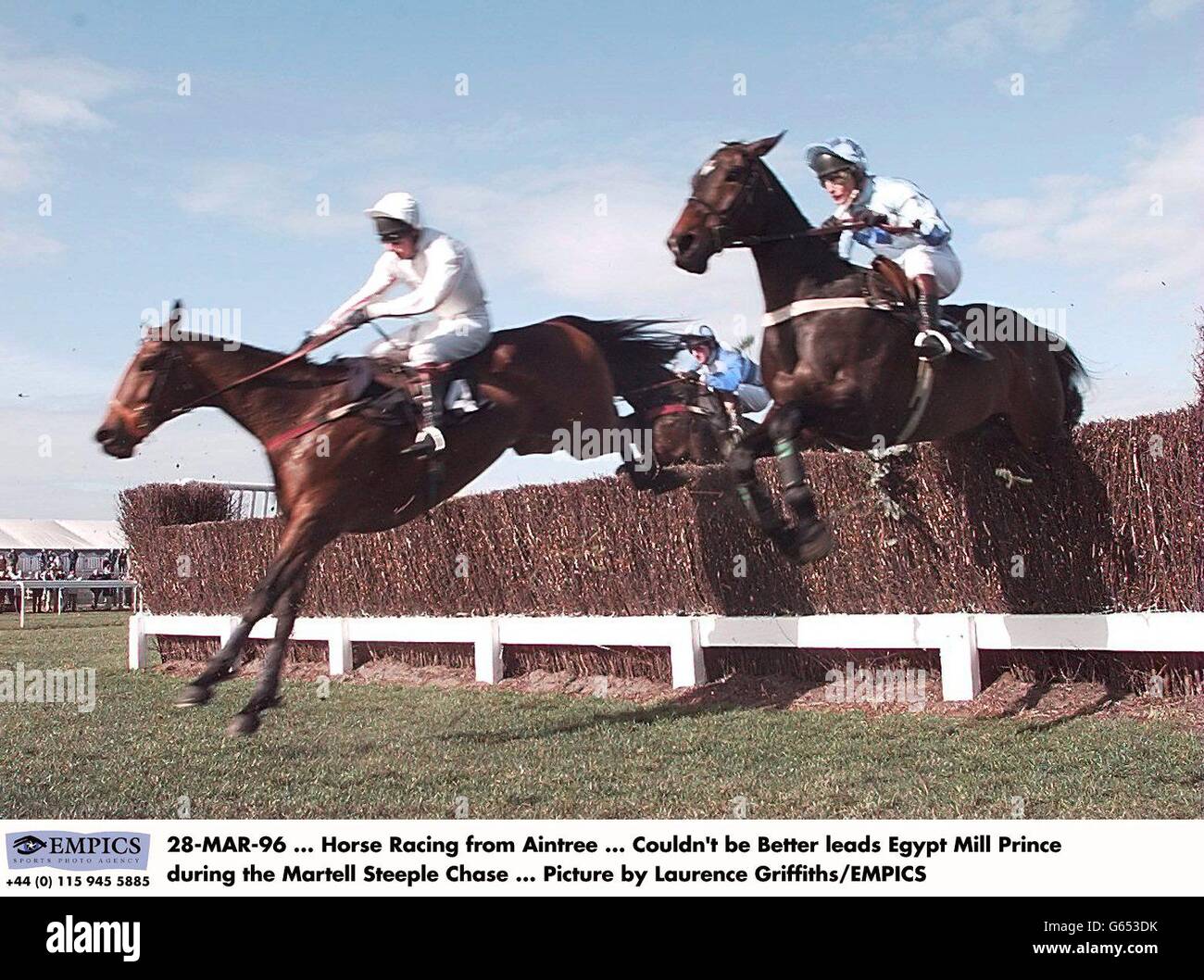 Horse Racing- Aintree. Couldn't Be Better leads Egypt Mill Prince during the Martell Steeple Chase Stock Photo