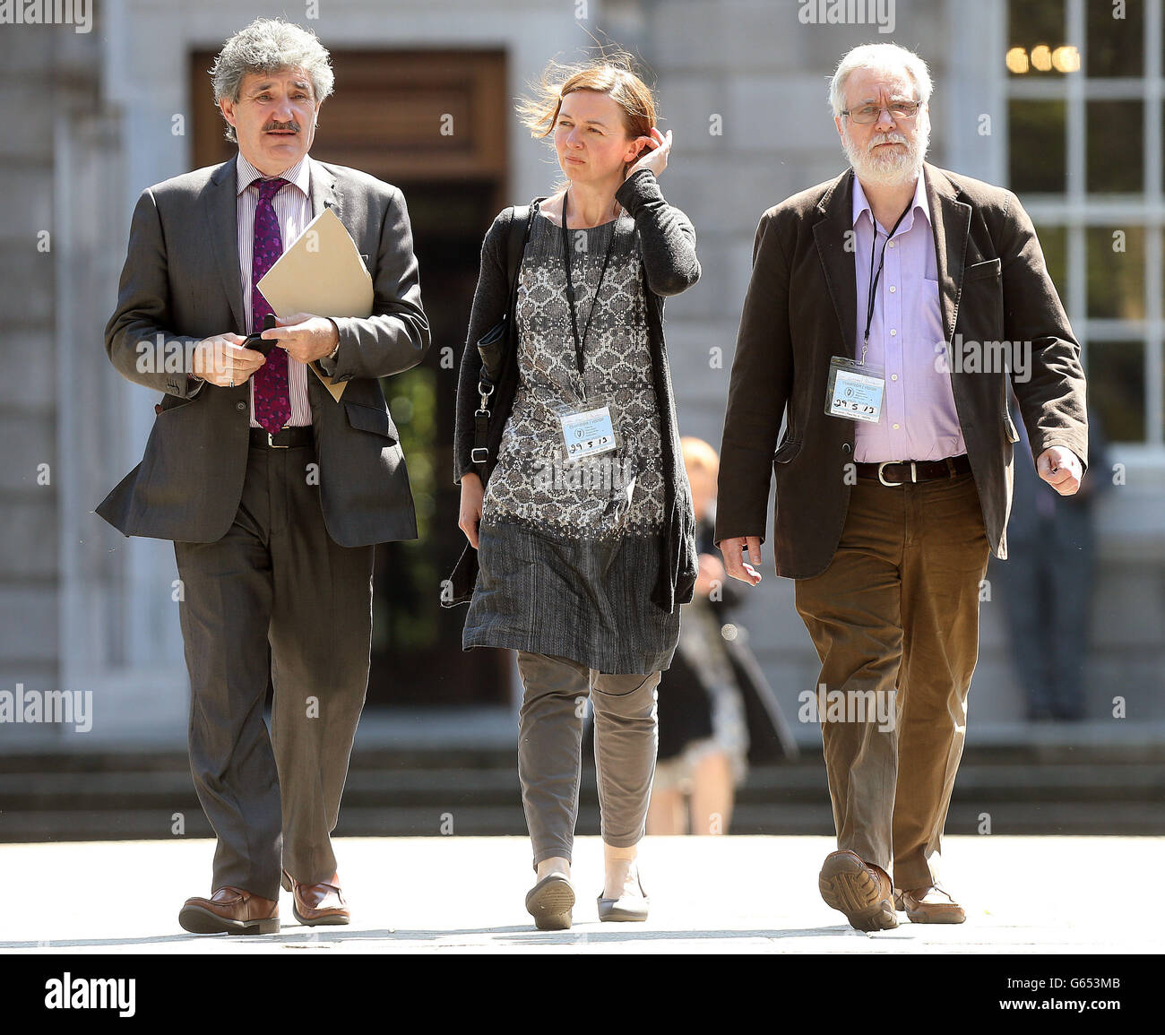 Independent TD John Halligan (left), Tom Curran (right) , partner of terminally ill multiple sclerosis sufferer Marie Fleming and her daughter Corrinna Moore leave Leinster House in Dublin after attending the Dail as the family stepped up their fight for her assisted suicide after being refused by the courts. Stock Photo