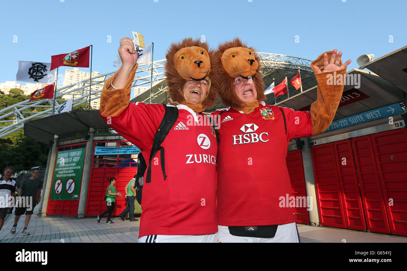 Lions fans arrive for the Tour Match at the Hong Kong Stadium, Hong Kong. PRESS ASSOCIATION Photo. Picture date: Saturday June 1, 2013. See PA Story RUGBYU Lions. Photo credit should read: David Davies/PA Wire. RESTRICTIONS: , Non-commercial use, Photographs cannot be altered or adjusted other than in the course of normal journalistic or editorial practice (including cropping/manipulation for purpose of formatting or superimposition of captions/headings). Call 44 (0)1158 447447 for further information. Stock Photo