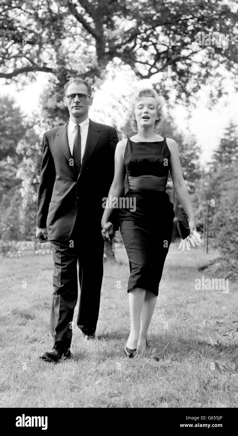 Film star Marilyn Monroe and her playwright husband Arthur Miller apend their first Sunday in England walking in the peace of the garden at Englefield Green, Surrey. Marilyn is to film in Britain with Sir Laurence Olivier. Stock Photo