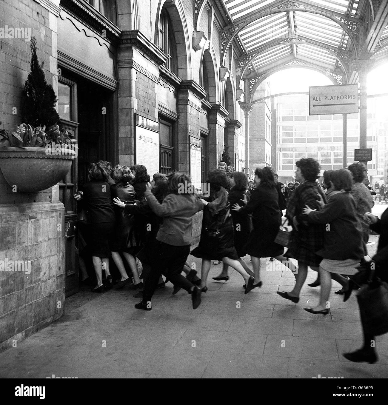 Beatles fans in film chase at Marylbone Station Stock Photo
