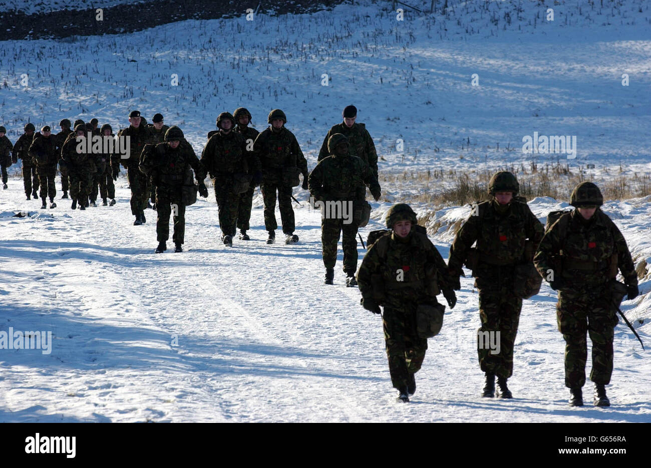 Soldiers at the Army Infantry Training School based at Catterick in north Yorkshire, walk across nearby ranges These Infantry recruits are dispersed to Regiments throughout the British Army on completion of their training. * Defence Secretary Geoff Hoon is expected to give further details later Tuesday of the call up of reservists in readiness for action in the Gulf. Stock Photo