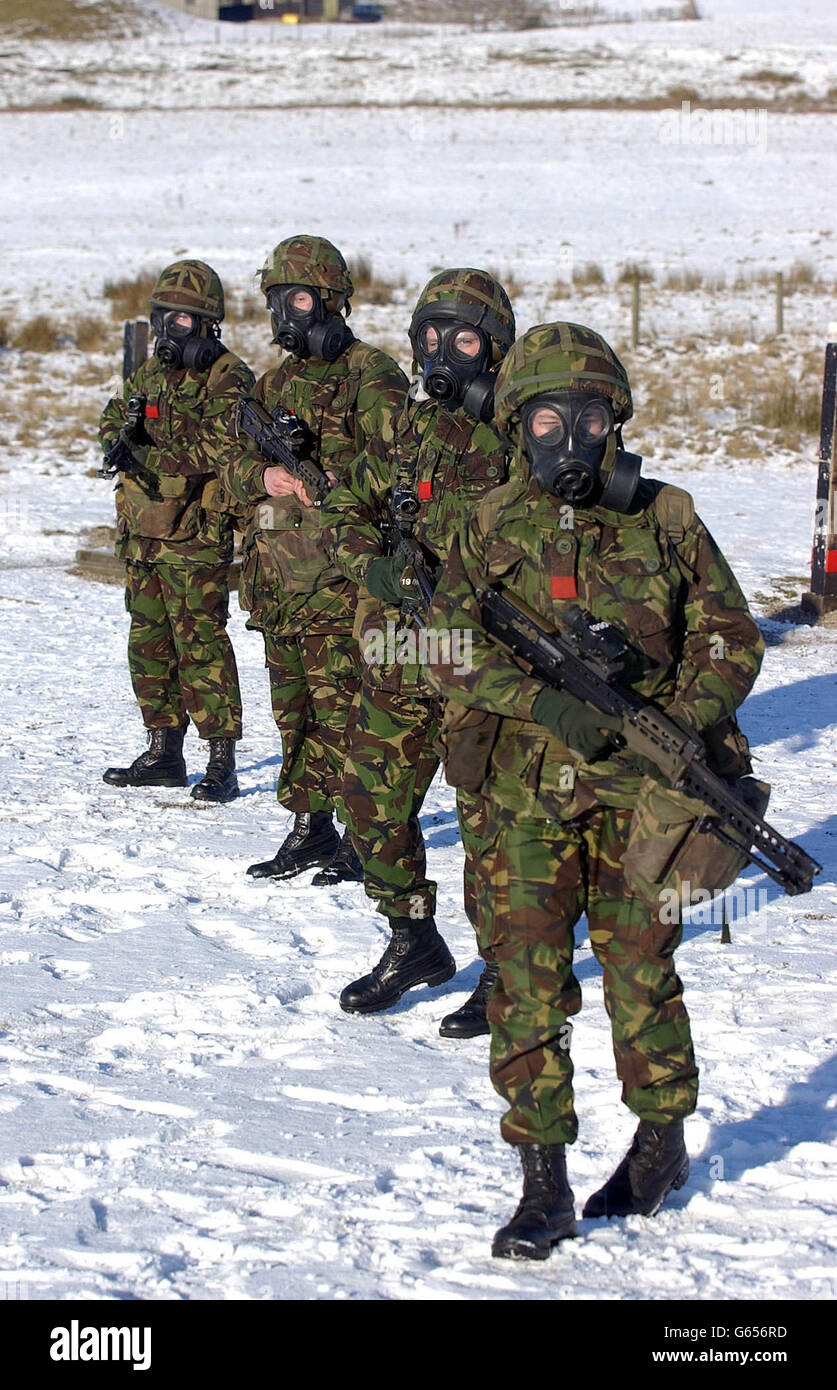 A soldiers at the Army Infantry Training School based at Catterick in north Yorkshire, wears NBC protection while training on nearby ranges. These Infantry recruits are dispersed to Regiments throughout the British Army on completion of their training. * Defence Secretary Geoff Hoon is expected to give further details later Tuesday of the call up of reservists in readiness for action in the Gulf. Stock Photo
