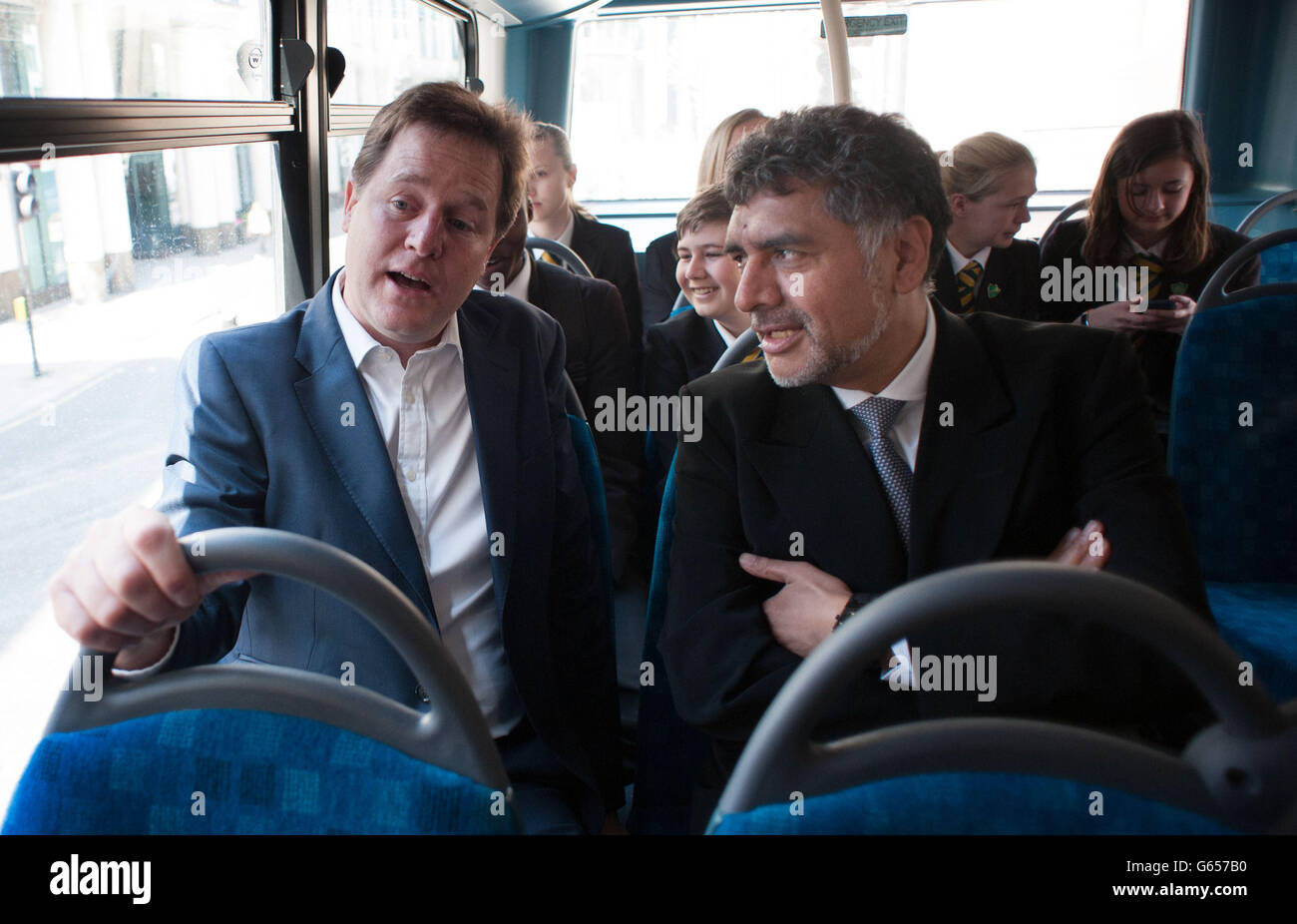 Deputy Prime Minister Nick Clegg and business entrepreneur James Caan meet teenagers aboard a bus travelling to several companies in London to discuss future career opportunities and how to get on the employment ladder, as part of the government's Opening Doors Awards in which companies are encouraged to help young people into work placements. Stock Photo
