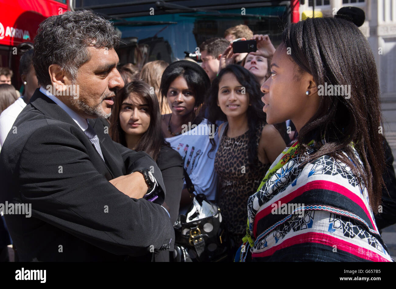 Business entrepreneur James Caan meets teenagers aboard a bus travelling to several companies in London to discuss future career opportunities and how to get on the employment ladder, as part of the government's Opening Doors Awards in which companies are encouraged to help young people into work placements. Stock Photo
