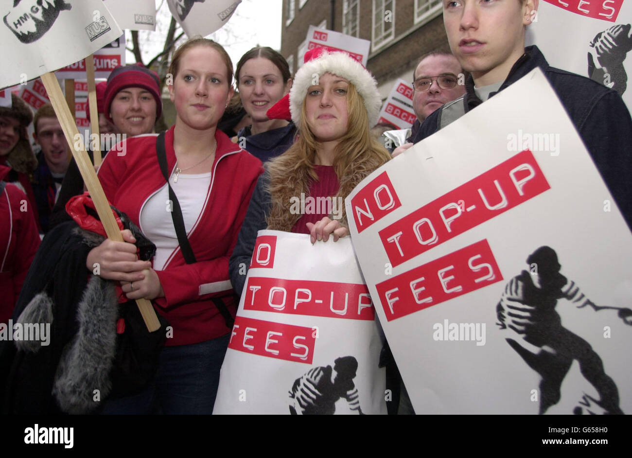 Charlotte Briggs (centre), Sarah Carty (centre left) and Gordon Ashenhurst (right), all students from Stirling University, protests against top-up fees outside the University of London Student Union. 24/01/04 Cambridge University students set off Saturday 24 January, 2004, on a 60-mile protest march to London to highlight their opposition to the Government's plans to introduce university top-up fees. The 12 students aim to arrive in London in time to join a mass demonstration held by the National Union of Students to coincide with a crucial debate in the House of Commons, London on Tuesday 27 Stock Photo
