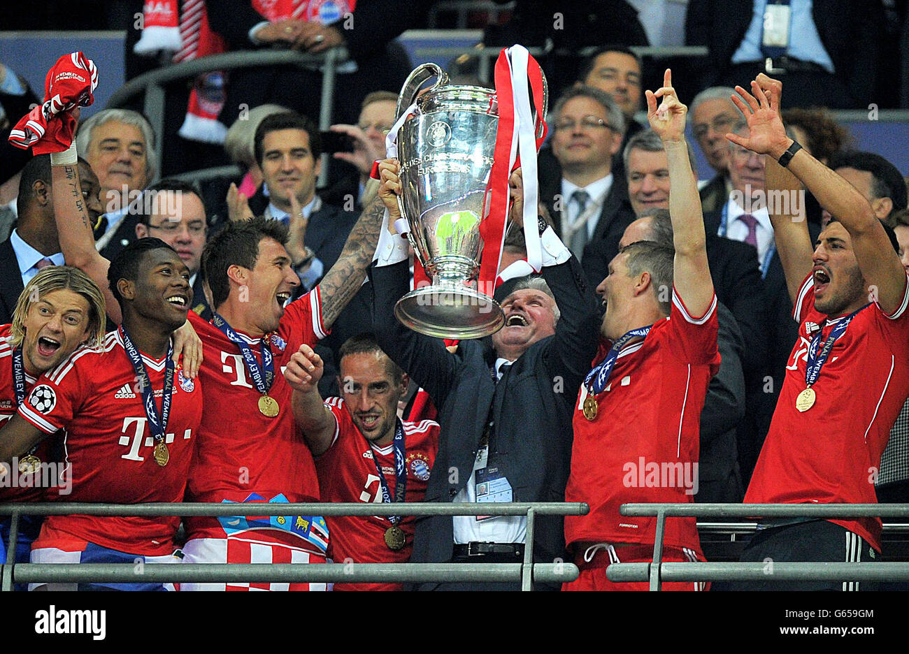 Bayern Munich manager Jupp Heynckes lifts the UEFA Champions League trophy with his team during the UEFA Champions League Final at Wembley Stadium, London. PRESS ASSOCIATION Photo. Picture date: Saturday May 25, 2013. See PA Story SOCCER Final. Photo credit should read: Martin Rickett/PA Wire. Stock Photo