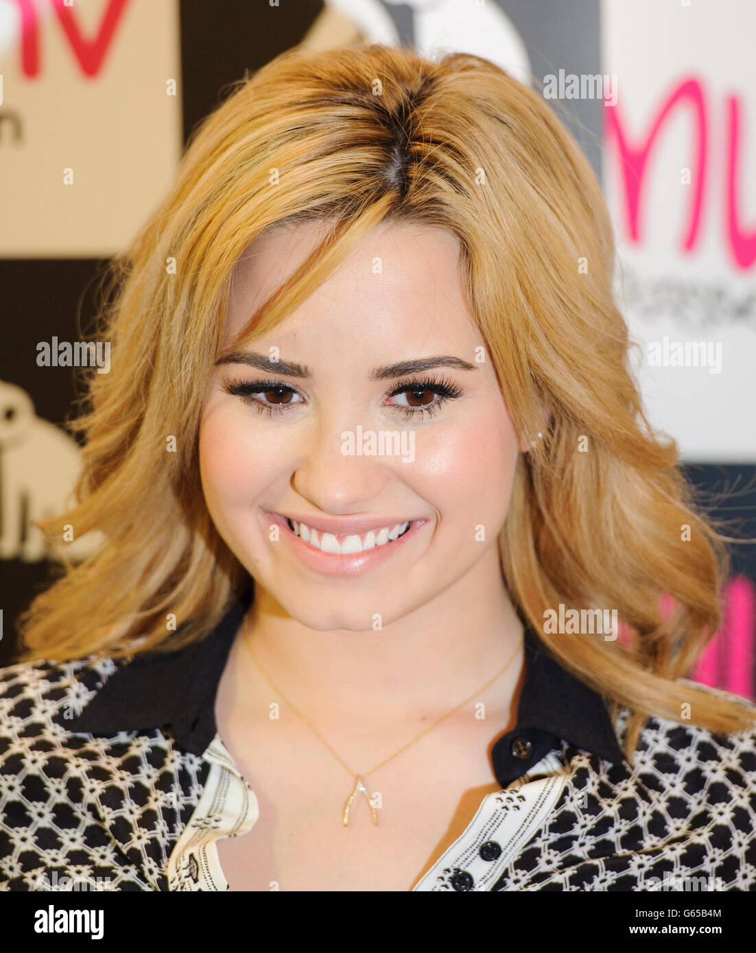 Demi Lovato attends a signing session at HMV, on Oxford Street, central London. Stock Photo