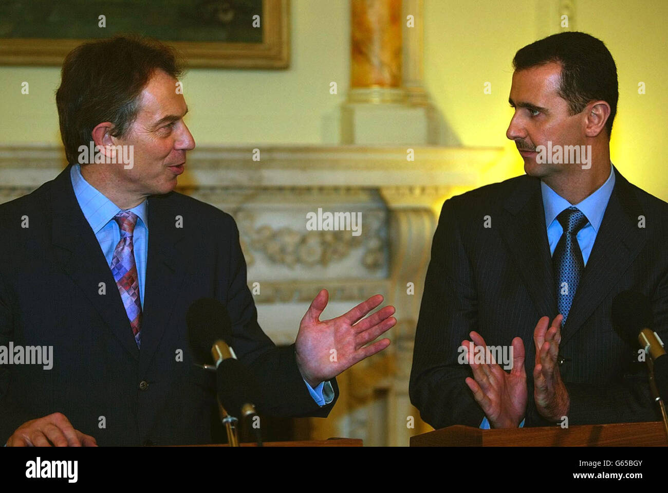 British Prime Minister, Tony Blair, left, speaks with the President of Syria, Bashar Al-Assad at a joint press conference in Downing St, London. Stock Photo