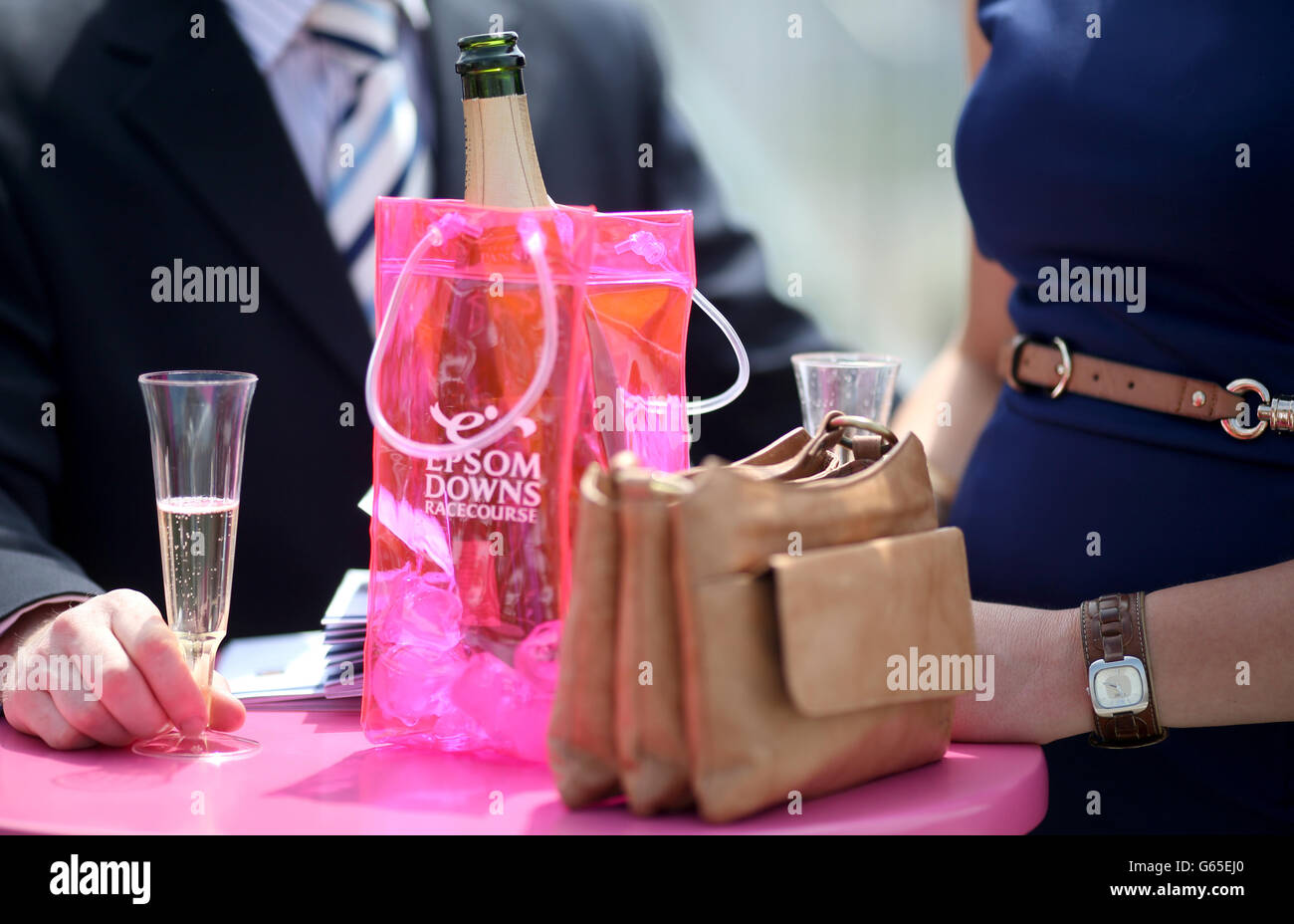 Horse Racing - The Investec Ladies Day - Epsom Downs Racecourse. A pink cool bag for Champagne on a table at Epsom Downs Racecourse Stock Photo