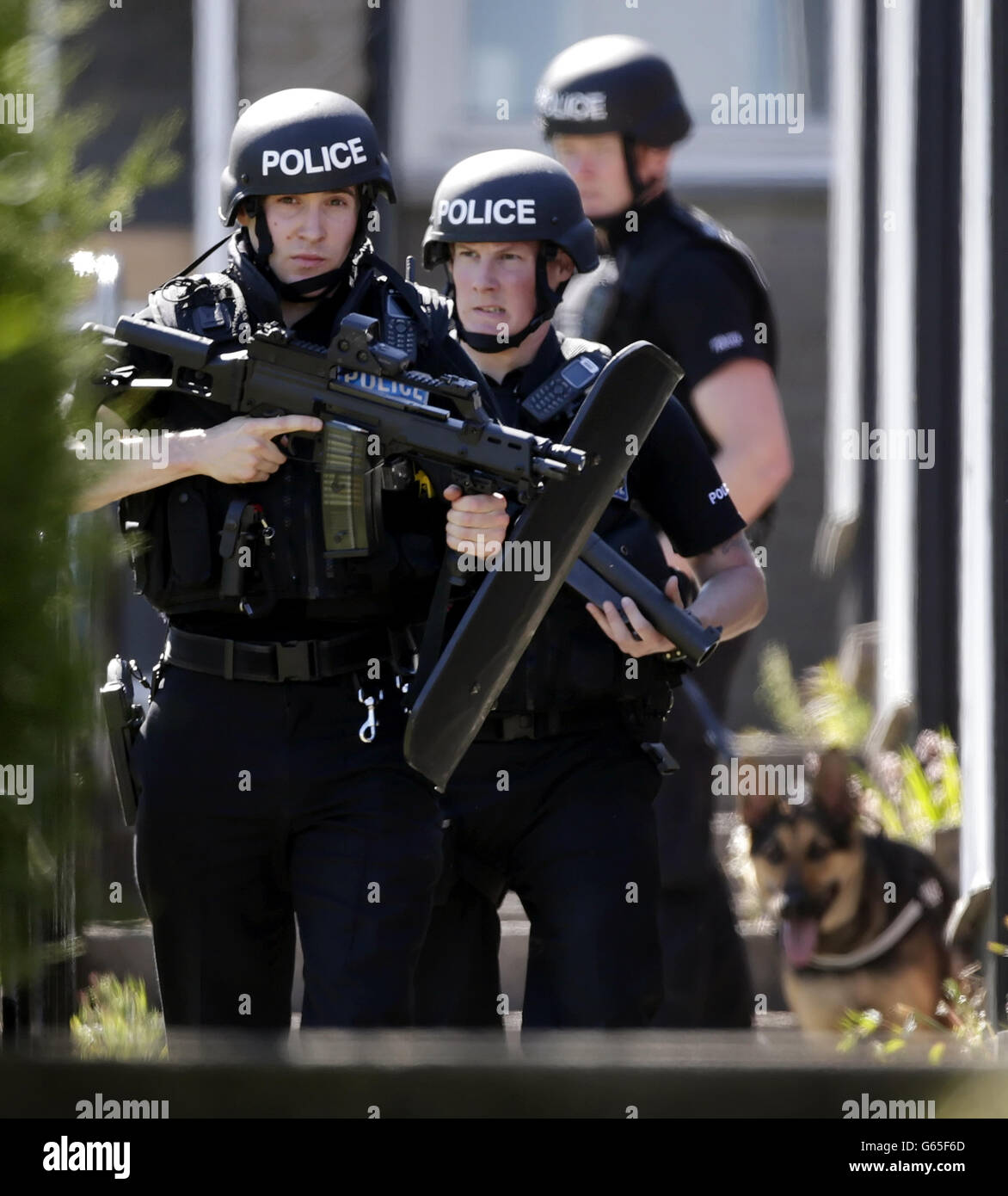 Police outside a flat in the Heathryfold area of Aberdeen, responding to an incident involving a man who is believed to remain inside. Stock Photo