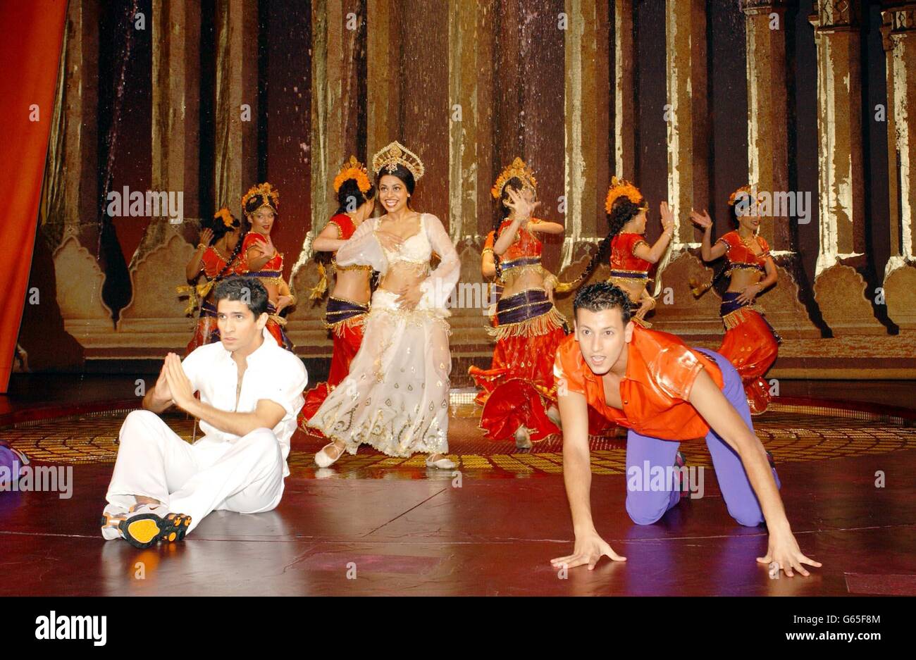 Actor Raza Jaffery, who plays Akaash, (L) and actress Ayesha Dharker, who plays Rani, leads the dancers during a rehearsal of AR Rahman's musical 'Bombay Dreams', produced by Andrew Lloyd Webber at the Apollo Theatre in Victoria, London. Stock Photo