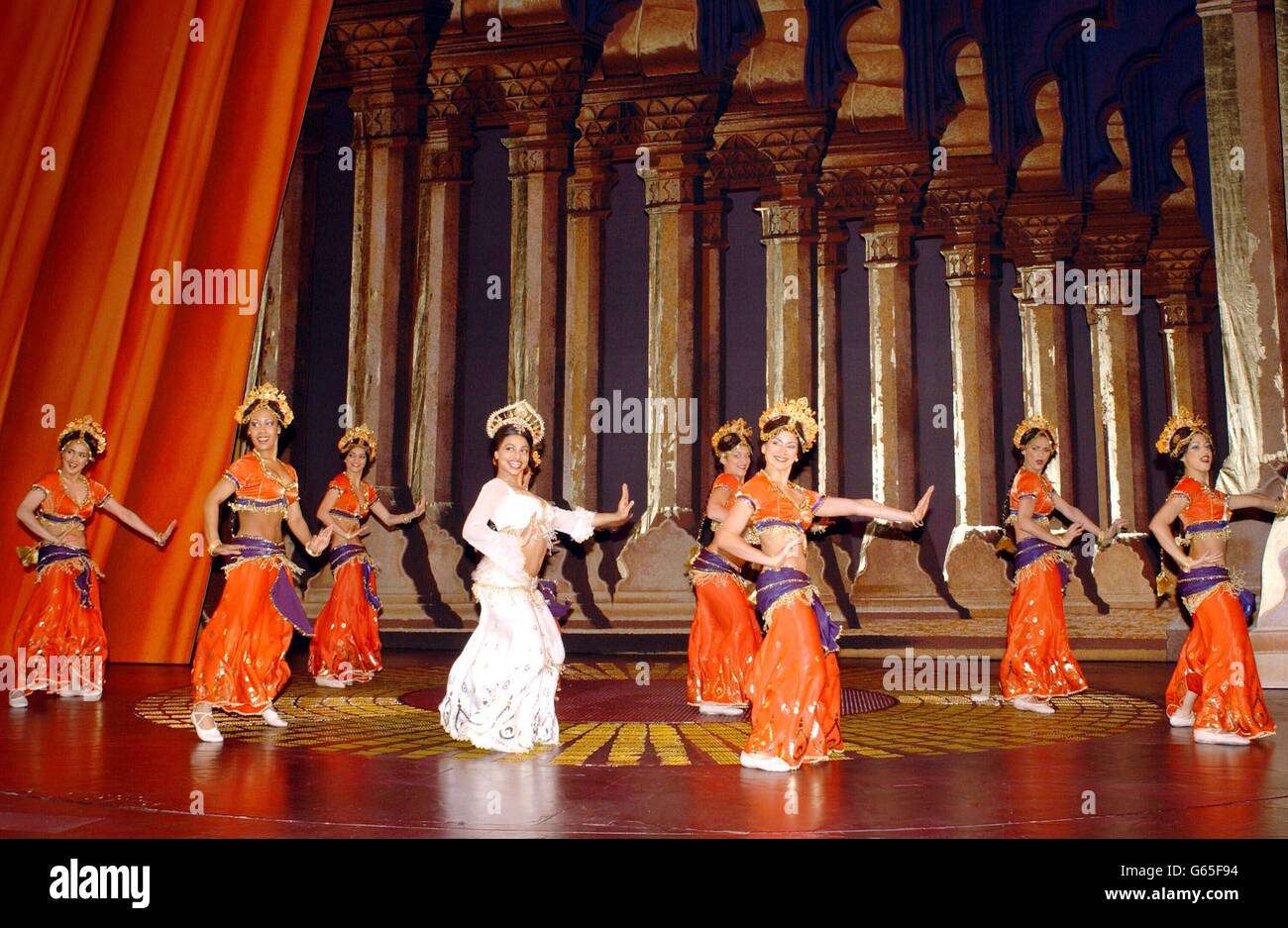 Actress Ayesha Dharker, who plays Rani, leads the dancers during a rehearsal of AR Rahman's musical 'Bombay Dreams', produced by Andrew Lloyd Webber at the Apollo Theatre in Victoria, London. Stock Photo