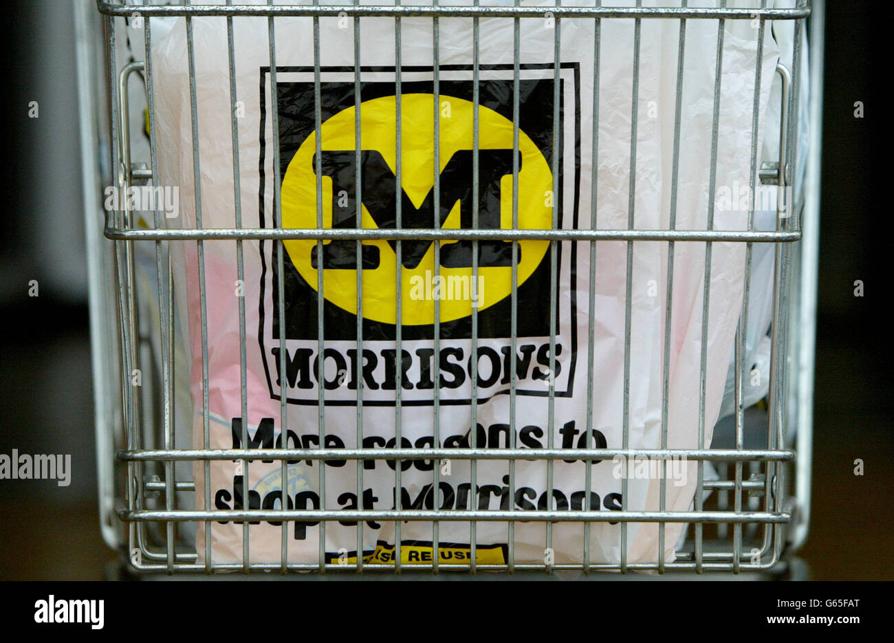 Morrisons carrier bag placed within trolly morrisons supermarket in