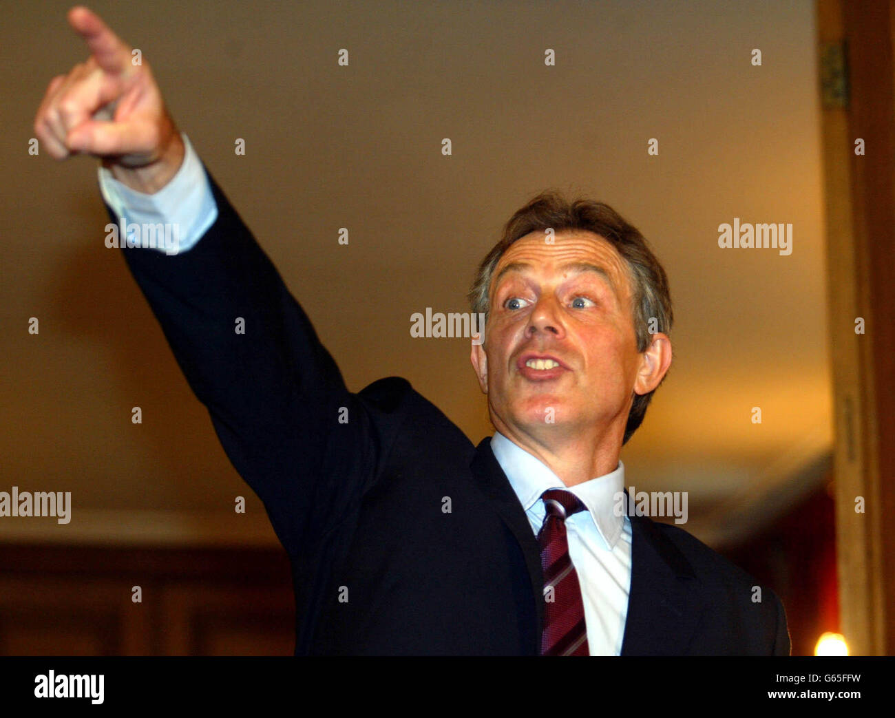 Prime Minister Tony Blair speaks at a Downing Street Press Conference. Blair said Monday that the Iraqi leader Saddam Hussein can still peacefully end the standoff over weapons of mass destruction, * ... but warned that he will be disarmed by force if he does not. Stock Photo