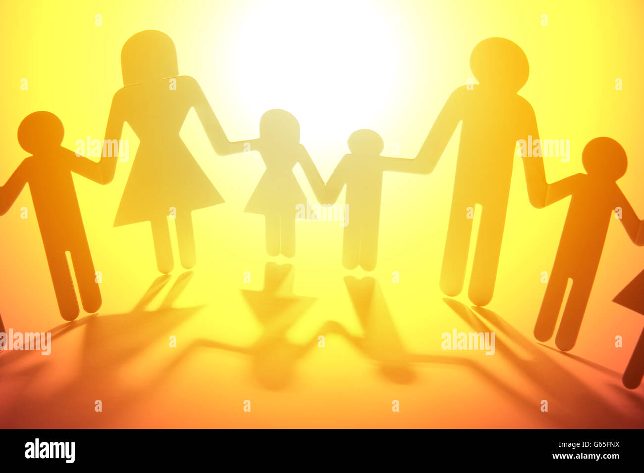 Family paper chain cutout holding hands Stock Photo - Alamy