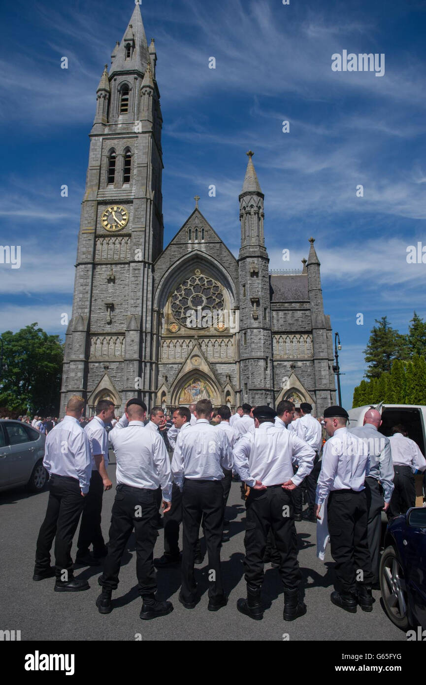 The colour party at the funeral of former Republican Sinn Fein leader Ruairi O Bradaigh at the Sacred Heart Church, Roscommon, before his burial at to St. Coman's Cemetery. Stock Photo