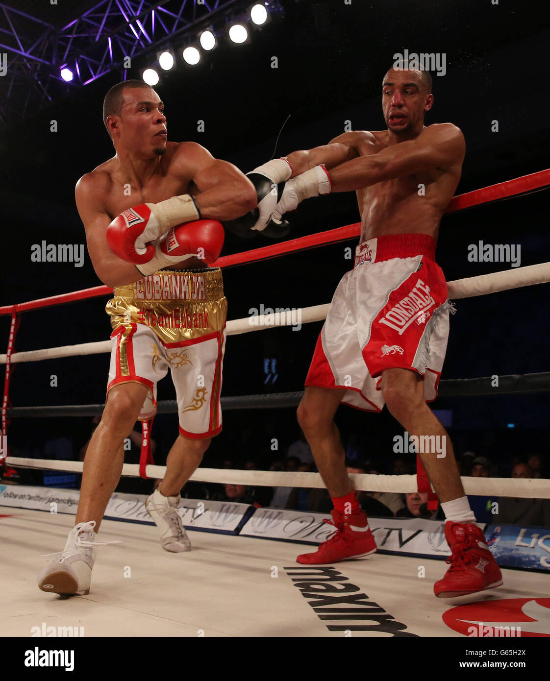 Chris Eubank Junior (left) during his 8th round stoppage win over Tyan Booth in an 8 round Supermiddle weight bout at Glow at the Bluewater, Kent. Stock Photo