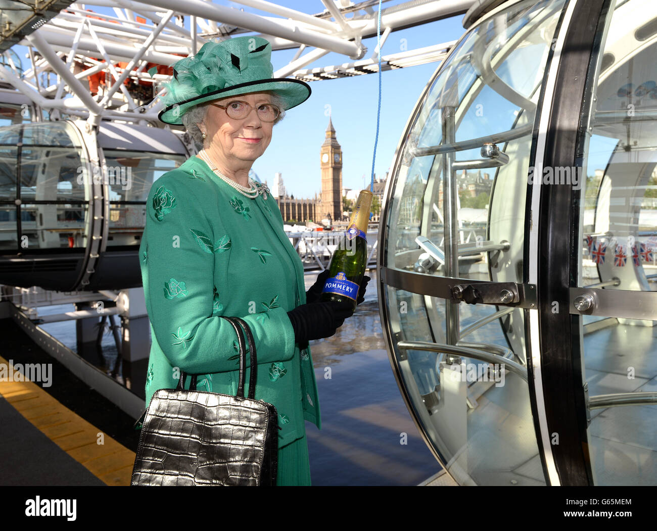 s Coronation and unveiled a plaque by a look-a-like of Queen Elizabeth II. Stock Photo