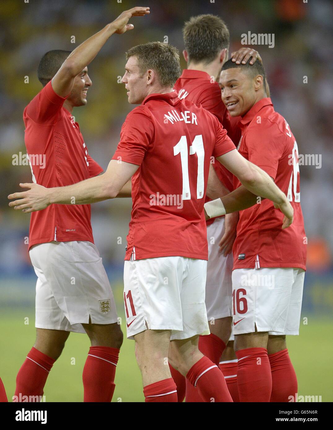 England's Alex Oxlade-Chamberlain (right) celebrates scoring their first goal of the game with team-mates Stock Photo