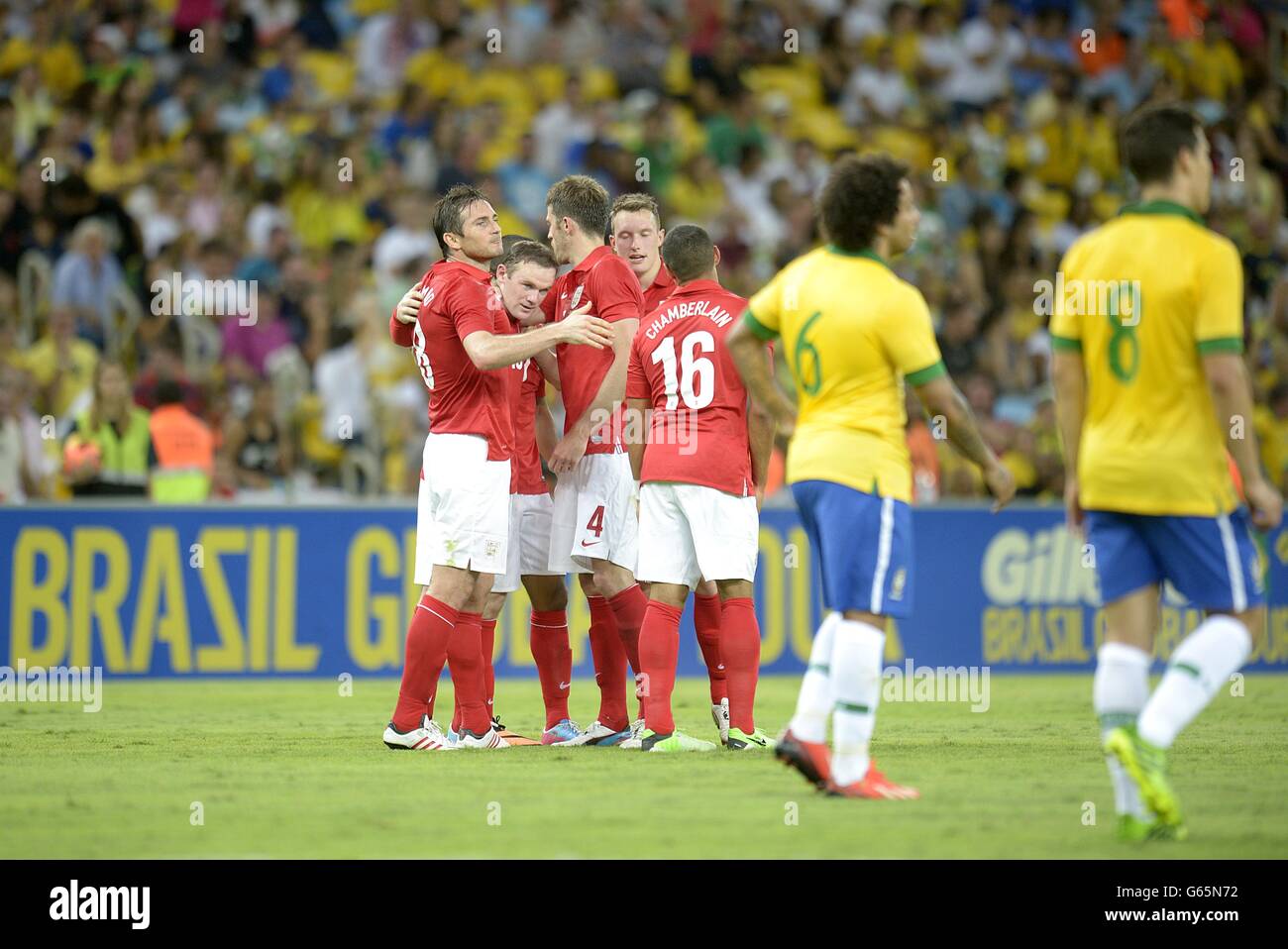 England's Wayne Rooney (second left) celebrates scoring their second goal of the game with team-mates Stock Photo