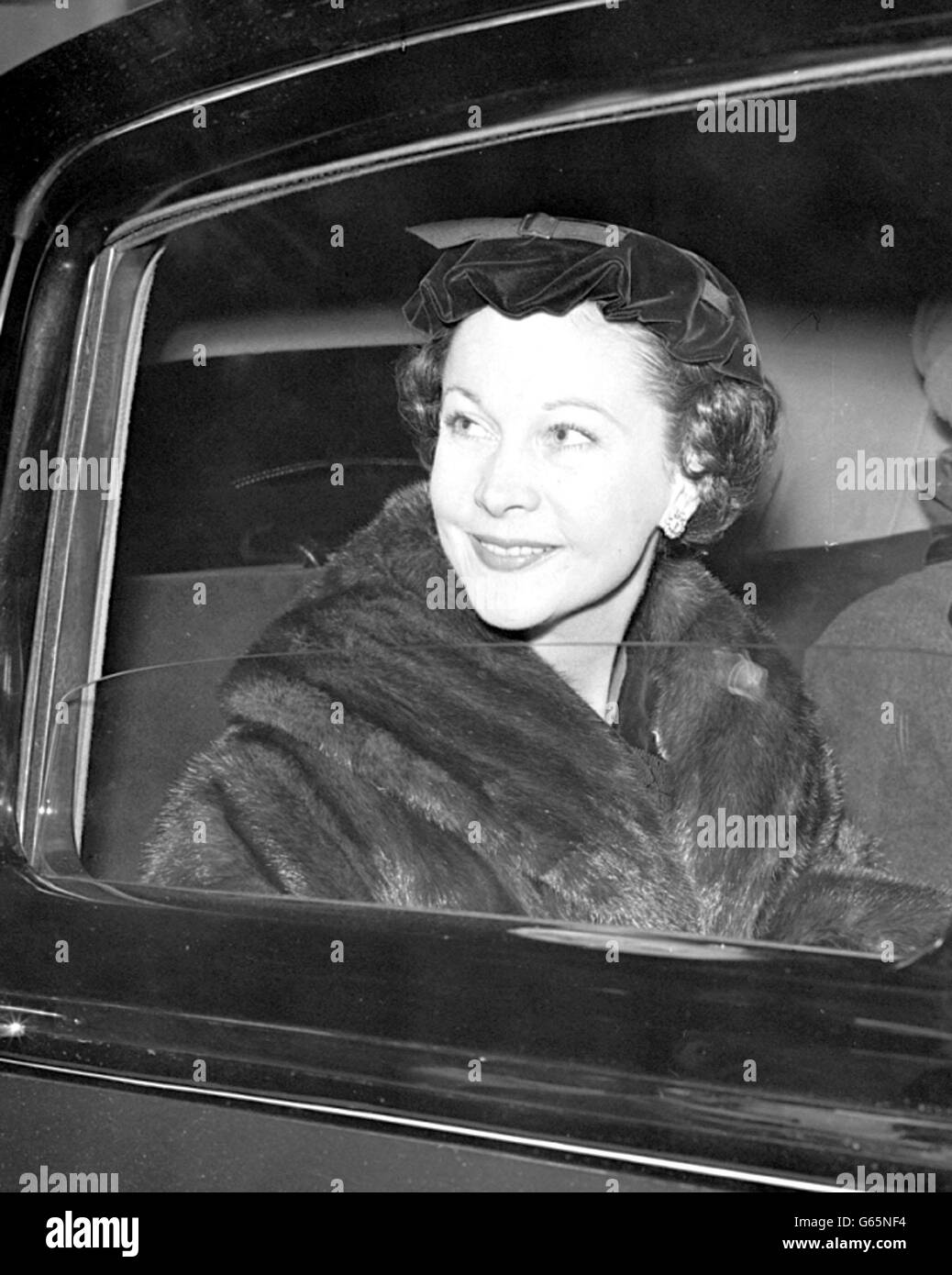 Actress Vivien Leigh returned to London airport, from Paris, where she has been having dress fittings in readiness for her part in the film 'The Deep Blue Sea'. Stock Photo
