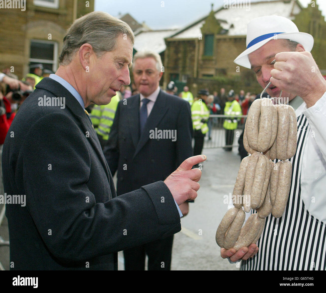 The Prince of Wales is presented with a string of local sausages by butcher Cliff Cowburn during a visit to Clitheroe in Lancs. Later, he travelled to Chipping on a new rural bus route during a day long visit to the county. * He chatted to passengers on the 29-seater vehicle during the 20-minute journey through picturesque landscape which is said to have been the inspiration for JRR Tolkien's Middle Earth. The Bowland Transit project, which begins operating in April, aims to improve transport services for residents in small rural communities. Stock Photo