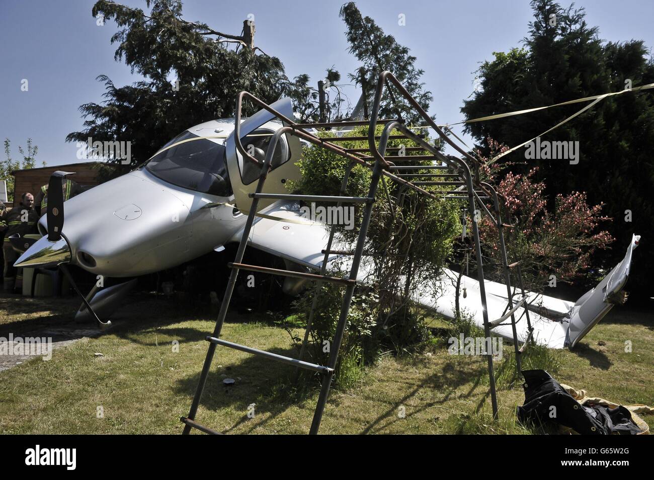 Plane crashes into garden Stock Photo